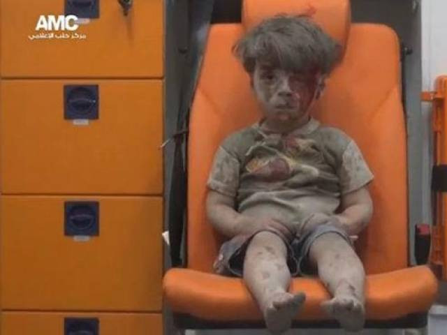 a still image taken on august 18 2016 from a video posted on social media said to be shot in aleppo on august 17 2016 shows a boy with bloodied face sitting in an ambulance after an airstrike syria a still image taken on august 18 2016 from a video posted on social media said to be shot in aleppo on august 17 2016 shows a boy with bloodied face sitting in an ambulance after an airstrike syria
