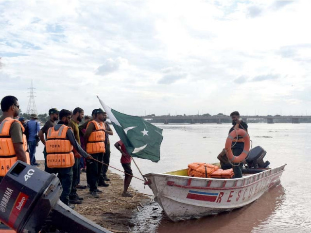 pdma staff patrols the ravi river in a boat near lahore a rescue operation was initiated after india released water into the river triggering fears of flooding photo online pdma staff patrols the ravi river in a boat near lahore a rescue operation was initiated after india released water into the river triggering fears of flooding photo online
