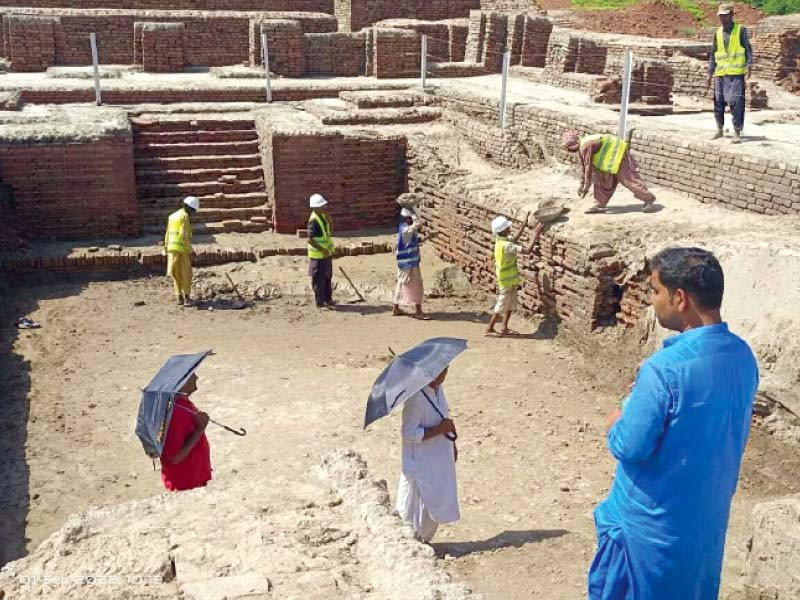 archeology department officials direct labours during repairs of the ancient indus valley civilization site of the mohenjo daro near larkana photo express