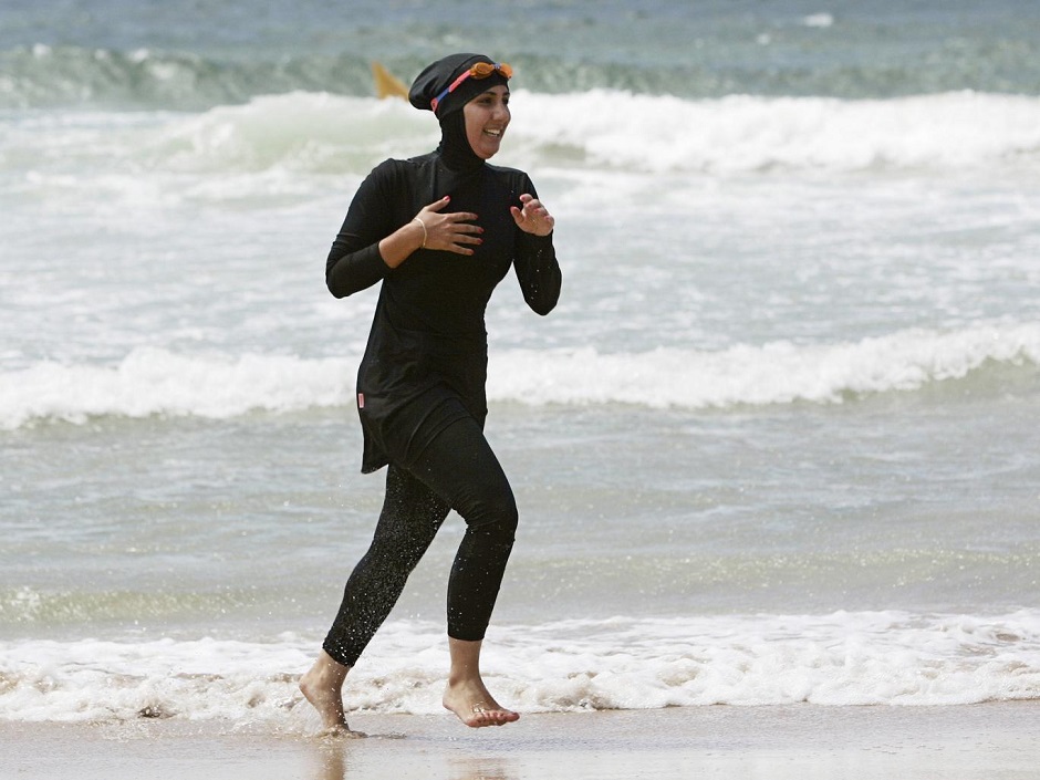 volunteer surf life saver mecca laalaa runs along a beach photo reuters