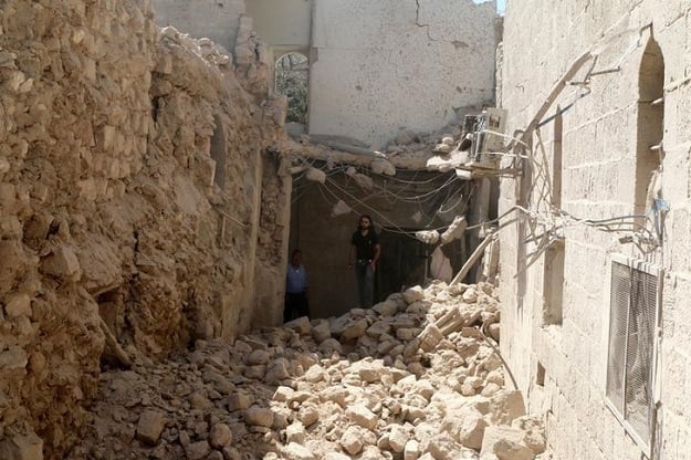 residents inspect their damaged homes after an airstrike photo reuters