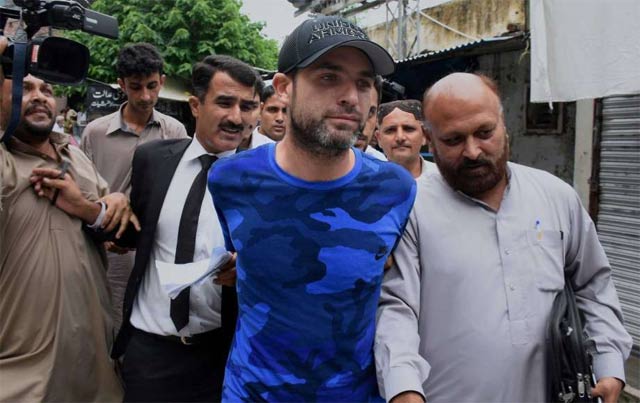 barret amid tight security was deported from lahore airport and is travelling to new york on a pia flight photo courtesy ap