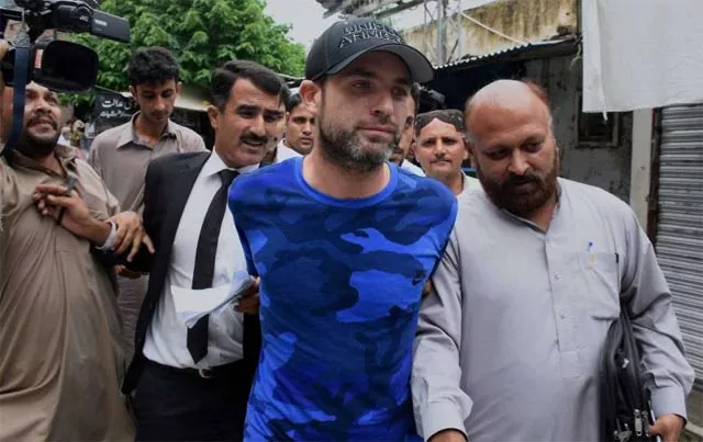 barret amid tight security was deported from lahore airport and is travelling to new york on a pia flight photo courtesy ap barret amid tight security was deported from lahore airport and is travelling to new york on a pia flight photo courtesy ap
