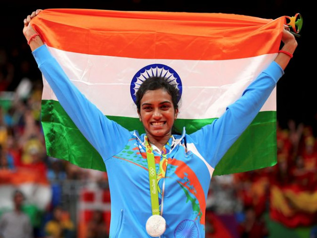 silver medallist p v sindhu ind of india poses with an indian national flag in 2016 rio olympics badminton women 039 s singles victory ceremony at rio de janeiro brazil on august 19 2016 photo reuters silver medallist p v sindhu ind of india poses with an indian national flag in 2016 rio olympics badminton women 039 s singles victory ceremony at rio de janeiro brazil on august 19 2016 photo reuters