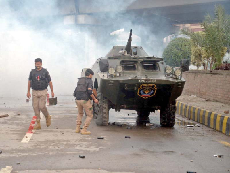police lob tear gas shells and use batons to disperse protesting schoolteachers in peshawar photo ppi