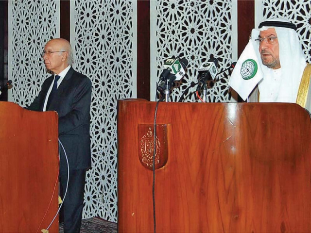 sartaj aziz and oic secretary general iyad amin madani at a joint news briefing photo app sartaj aziz and oic secretary general iyad amin madani at a joint news briefing photo app