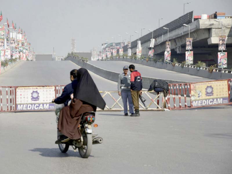 citizens face difficulty while travelling within the twin cities due to security barriers placed on murree road rawalpindi photo online