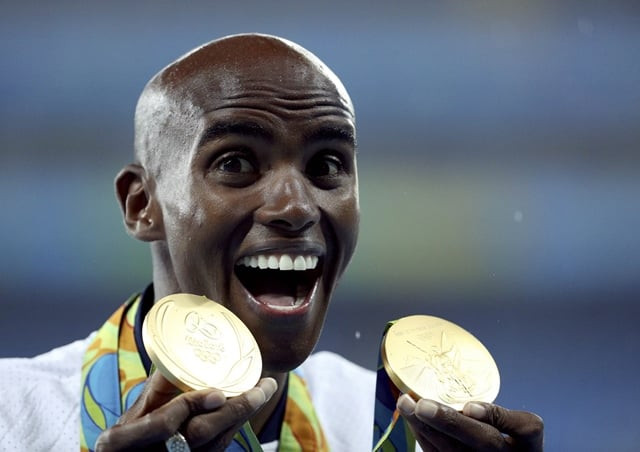 mo farah poses with his medals photo reuters