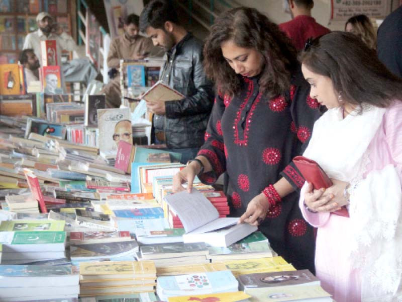 people browse through books for sale on discount by publishers at the 15th international urdu conference under way at arts council pakistan karachi photo online