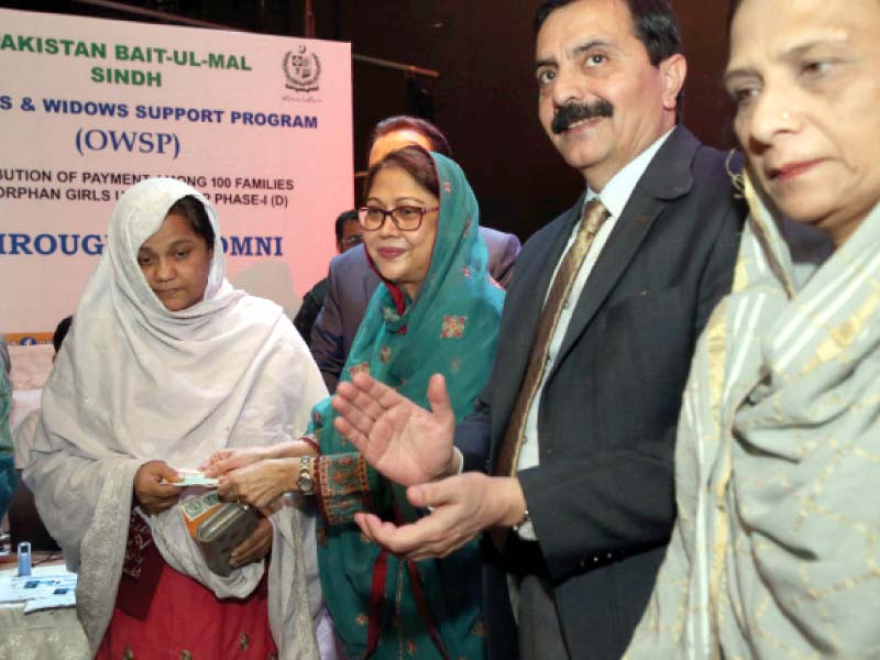 ppp women wing president faryal talpur hands over compensation cheque to a deserving woman at a convention organised by pakistan bait ul mal at pakistan arts council karachi photo express