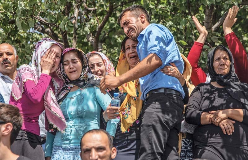 mourners weep during the funeral of the victims of saturday s attack on a wedding party in gaziantep in southeastern turkey photo afp