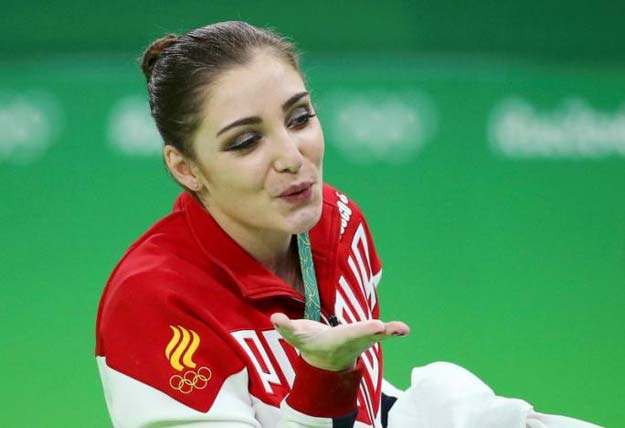 aliya mustafina rus of russia celebrates winning the gold photo reuters