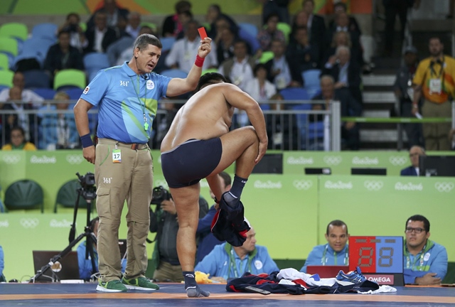 coaches of mandakhnaran ganzorig protest against the result of the match by taking off their clothes photo reuters