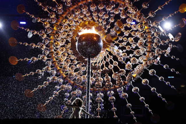 a false rain on the olympic flame during the closing ceremony of the rio games photo afp