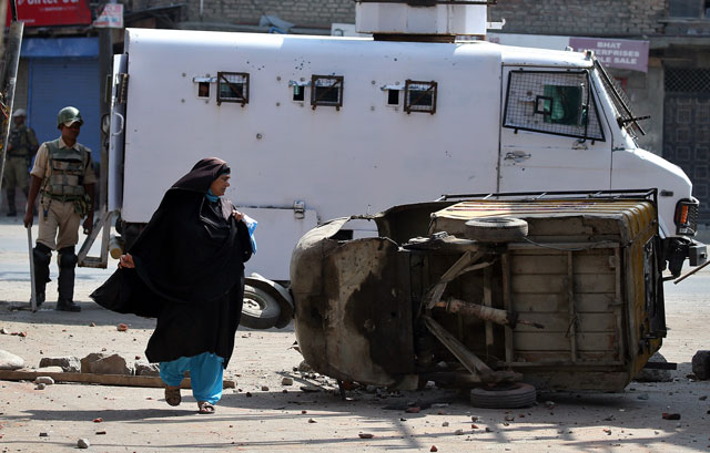 a car is seen damaged after a night of clashes between protesters and security forces in srinagar as the city remains under curfew following weeks of violence in indian occupied kashmir august 21 2016 photo reuters