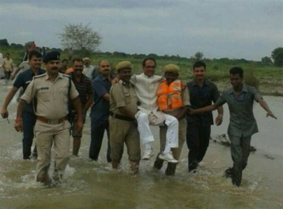 twitter users mock indian politician carried through floods