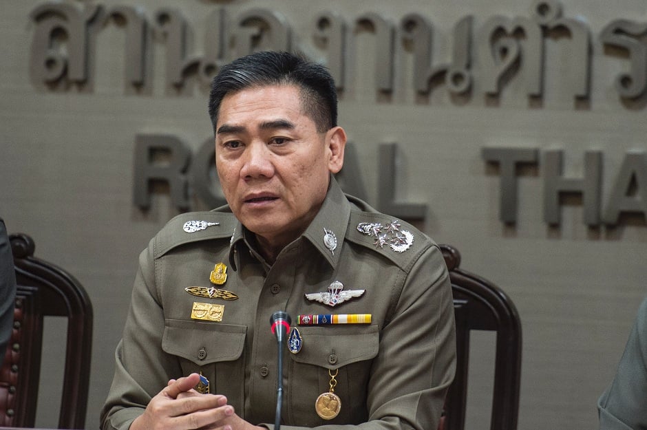 royal thai police chief chakthip chaijinda has asked all policemen to arrest pokemon players who play while using roads photo afp