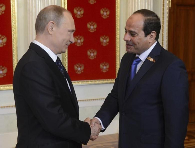 russian president vladimir putin l shakes hands with egyptian president abdel fattah al sisi photo reuters