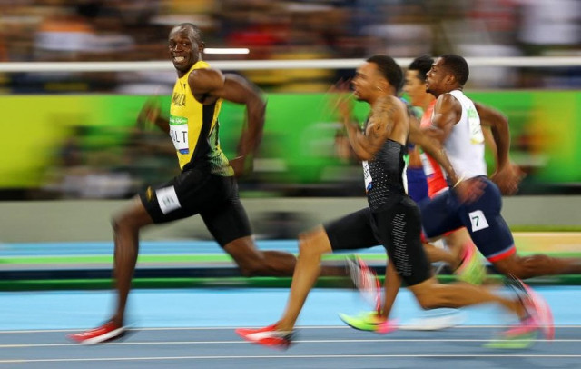 usain bolt of jamaica looks at andre de grasse of canada as they compete in the men 039 s 100m semifinal photo reuters