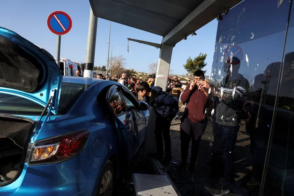 israelis look at the car on the scene where a suspected ramming attack took place in jerusalem february 10 2023 photo reuters