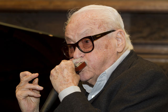 this file photo taken on february 29 2012 shows musician toots thielemans playing harmonica at a press conference for the toots90 to present the events organised for the 90th anniversary of the artist in la hulpe belgium photo afp