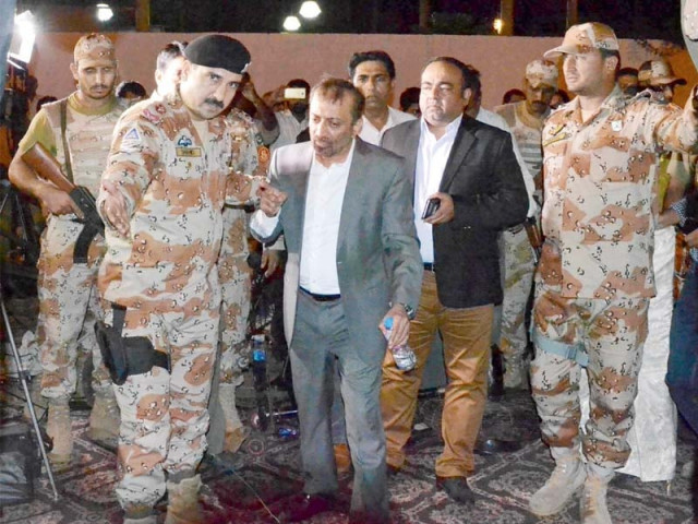 rangers escort away dr farooq sattar and khawaja izhar from karachi press club photo muhammad noman express rangers escort away dr farooq sattar and khawaja izhar from karachi press club photo muhammad noman express