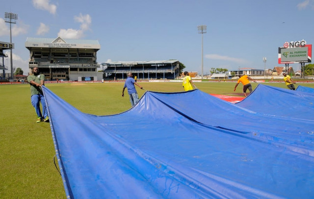 the wet outfield kept the ground staff busy on the fifth day as well in port of spain on august 22 2016 photo afp the wet outfield kept the ground staff busy on the fifth day as well in port of spain on august 22 2016 photo afp