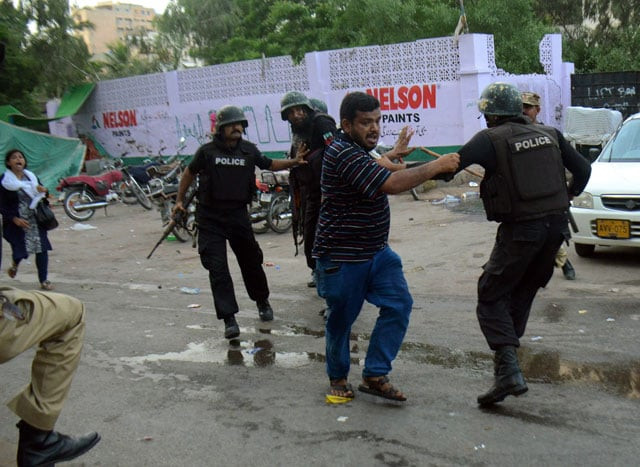 an mqm activist clashs with police personnel in karachi on monday augusut 22 2016 photo express an mqm activist clashs with police personnel in karachi on monday augusut 22 2016 photo express