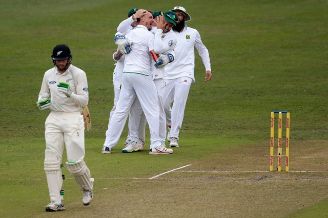 dale steyn is mobbed by his teammates as martin guptill walks dolefully back on august 20 2016 photo afp dale steyn is mobbed by his teammates as martin guptill walks dolefully back on august 20 2016 photo afp