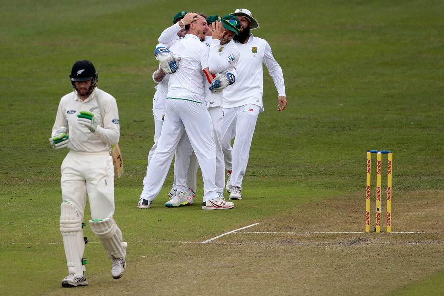 dale steyn is mobbed by his teammates as martin guptill walks dolefully back on august 20 2016 photo afp