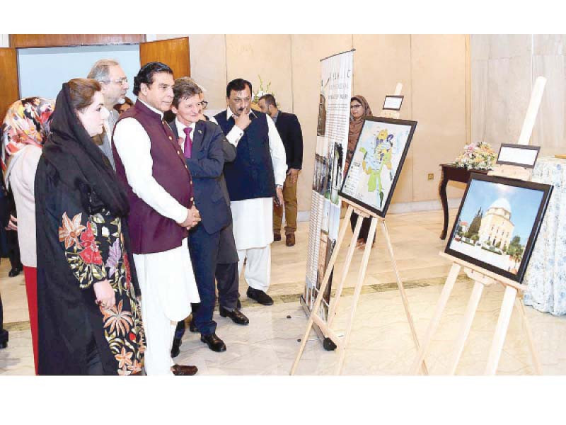 na speaker raja pervez ashraf and others see a photo exhibition on display at parliament house photo app