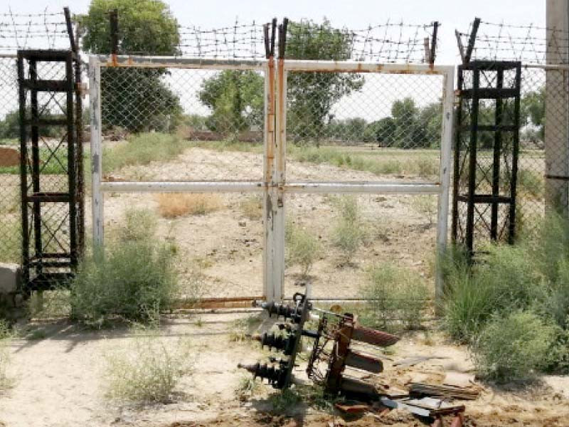 a broken piece of transformer lies near the fence photo express