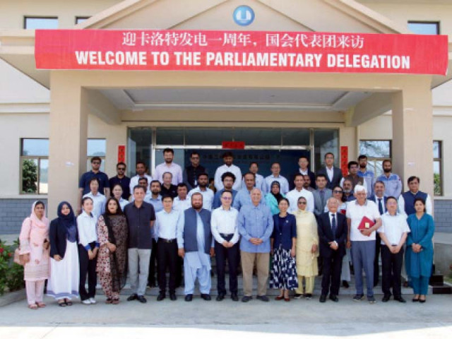 participants of a parliamentary delegation pose for a group picture after commemorating the 1st anniversary of the karot hydropower project photo express participants of a parliamentary delegation pose for a group picture after commemorating the 1st anniversary of the karot hydropower project photo express