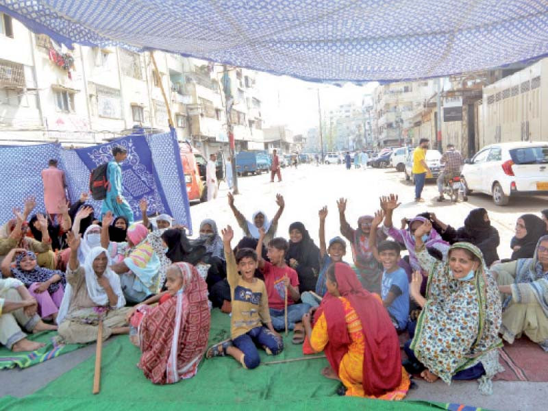 exasperated by prolonged power cuts in extreme hot weather women and children block a road in protest in the old haji camp neighbourhood of karachi photo jalal qureshi express