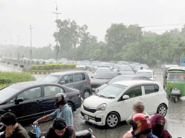 motorists are stuck in a traffic snarl up in gulberg amid a heavy downpour in the city photo nni motorists are stuck in a traffic snarl up in gulberg amid a heavy downpour in the city photo nni