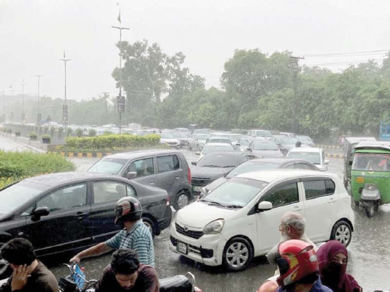 motorists are stuck in a traffic snarl up in gulberg amid a heavy downpour in the city photo nni