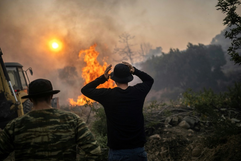 wildfires have been raging in greece amid scorching temperatures forcing mass evacuations in several tourist spots including on the islands of rhodes and corfu photo afp