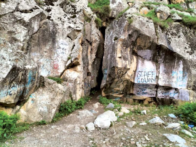 the graffiti painted by the visiting tourists has eclipsed the beauty of the scenic saiful malook cave photo express