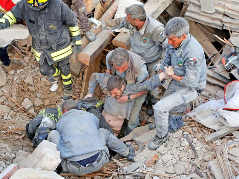 a man is rescued alive from the ruins following an earthquake in amatrice photo reuters