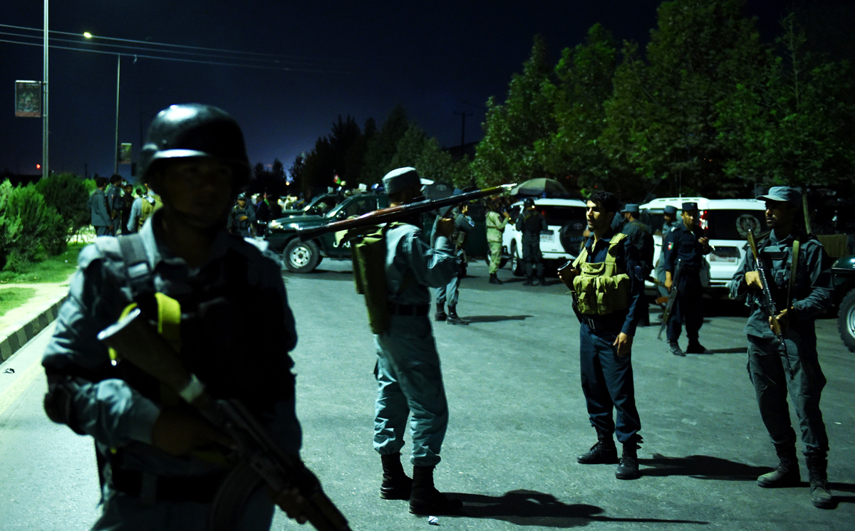 an afghan security personnel c holding a rocket propelled grenade stands guard near the site of explosion that targeted the elite american university of afghanistan in kabul on august 24 2016 photo afp