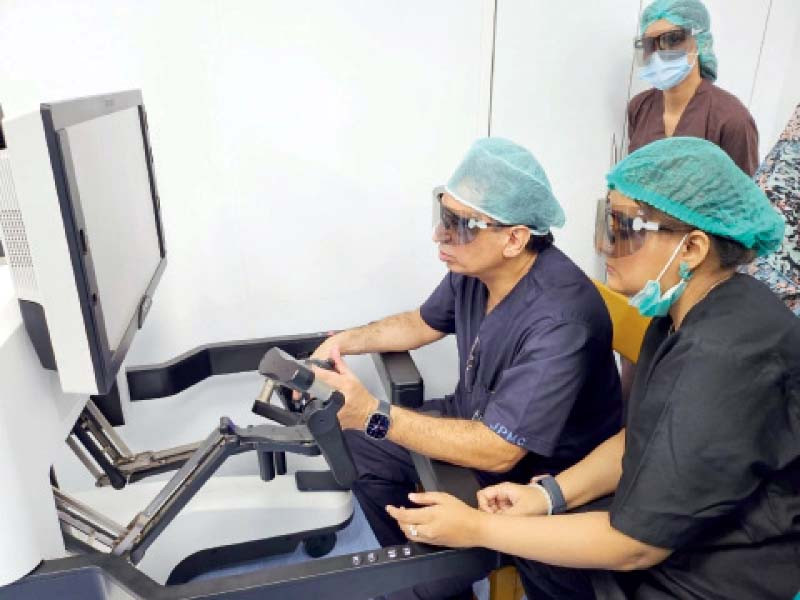 doctors at jinnah postgraduate medical centre perform the first robotic surgery at the health facility photo express