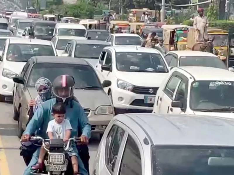 motorists caught up in a snarl up on a gujranwala road where such nightmarish scenes are almost a daily occurrence due to poor traffic management photo express