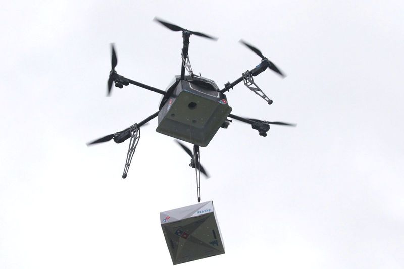 a delivery drone performs a test flight with a domino 039 s pizza box in auckland new zealand august 25 2016 photo reuters