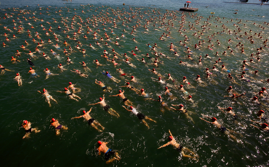 people swim during the annual public lake zurich crossing swimming event over a distance of 1 500 metres 4 921 ft in zurich switzerland photo reuters