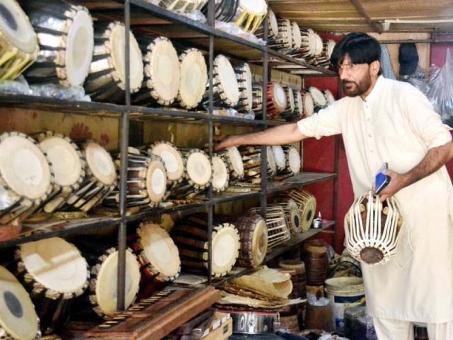 a craftsman sells meticulously crafted handmade musical instruments at his shop near bagh sardaran chowk in rawalpindi photo agha mahroz express a craftsman sells meticulously crafted handmade musical instruments at his shop near bagh sardaran chowk in rawalpindi photo agha mahroz express
