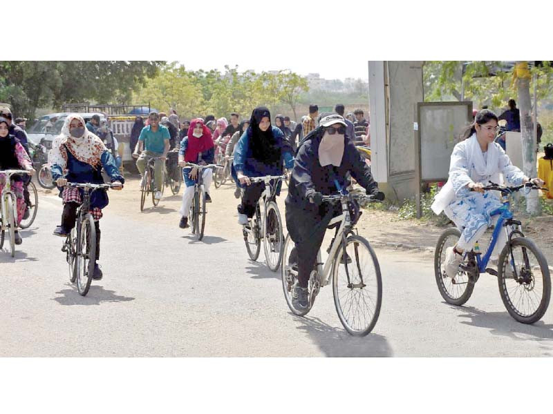 girl students take part in a cycle rally in the university of karachi to promote bicycles as a means of transportation within the campus photo express