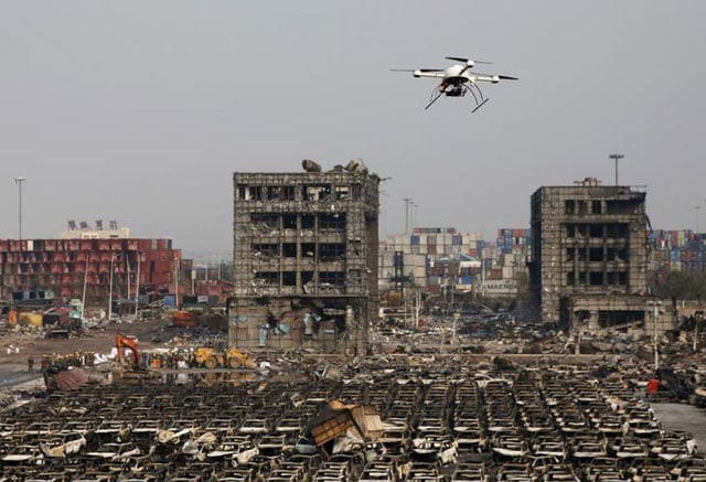 a drone operated by paramilitary police flies over the site of last week 039 s explosions at binhai new district in tianjin china august 17 2015 photo reuters a drone operated by paramilitary police flies over the site of last week 039 s explosions at binhai new district in tianjin china august 17 2015 photo reuters