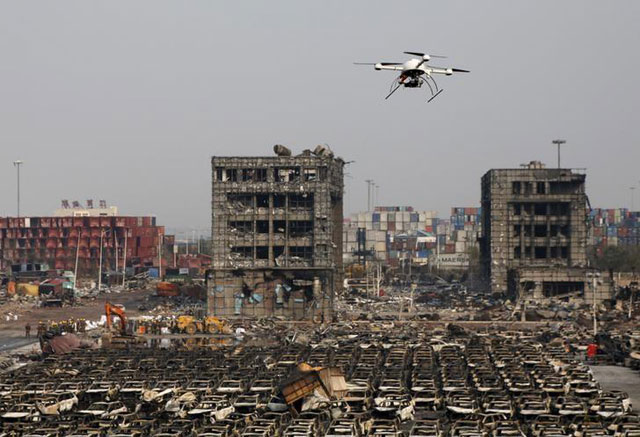 a drone operated by paramilitary police flies over the site of last week 039 s explosions at binhai new district in tianjin china august 17 2015 photo reuters