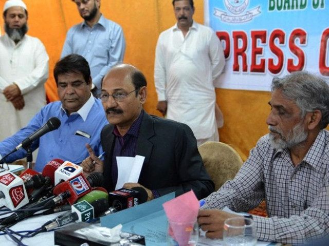 bsek chairperson anwar ahmed zai centre at a press conference photo express bsek chairperson anwar ahmed zai centre at a press conference photo express