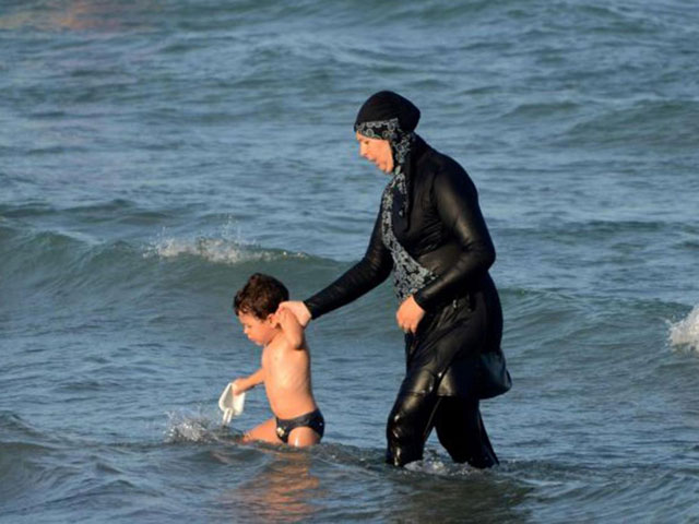the so called burkini bans never actually mention the word burkini although they are aimed at the garment which covers the hair but leaves the face visible and stretches down to the ankles photo afp